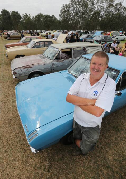 LOVE AT FIRST SIGHT: Phil Dean with blue his 1970 Chrysler Valiant utility, which has has owned for about five years. The classic car is one of five he owns and has undergone a restoration. Pictures: KYLIE ESLER