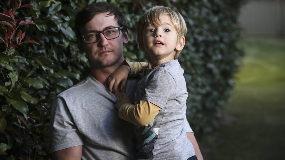 THEFT: Brad Ley with his son Bailey, 4, who has autism. 
