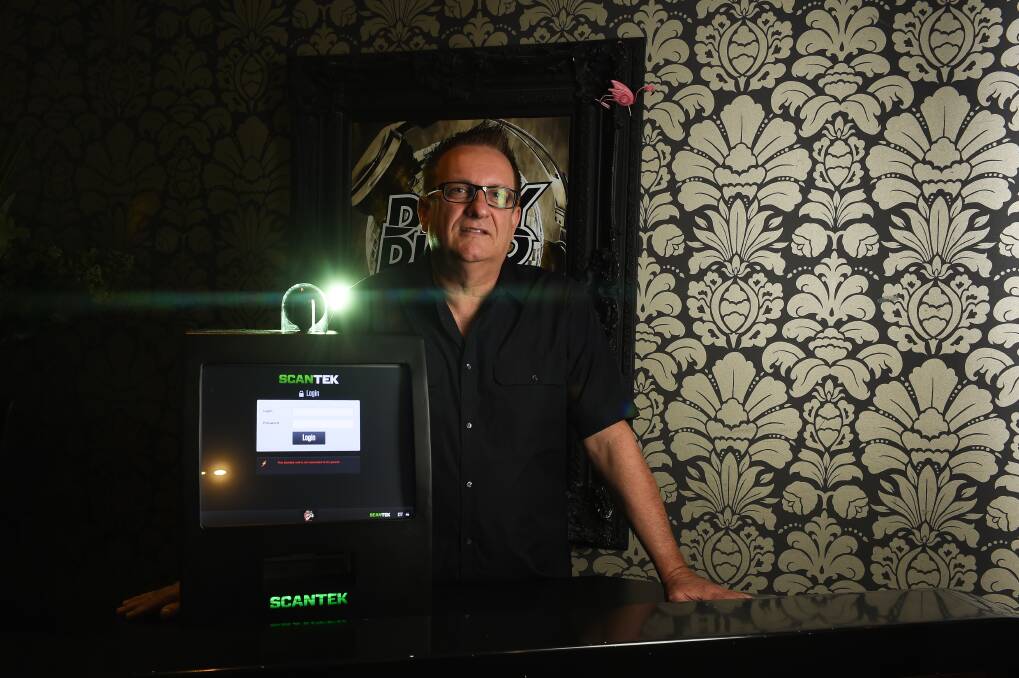 LOCKED OUT: Bended Elbow marketing manager Bernard Zamiara with the scanning system. Police hope more late night venues will sign up to the technology. Picture: MARK JESSER