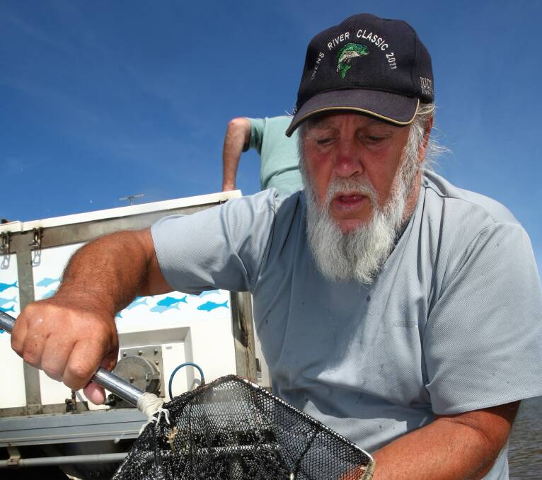 PASSIONATE: The death of Stan Miosge, pictured during a fish restocking at Lake Hume in 2012, has shocked many.  