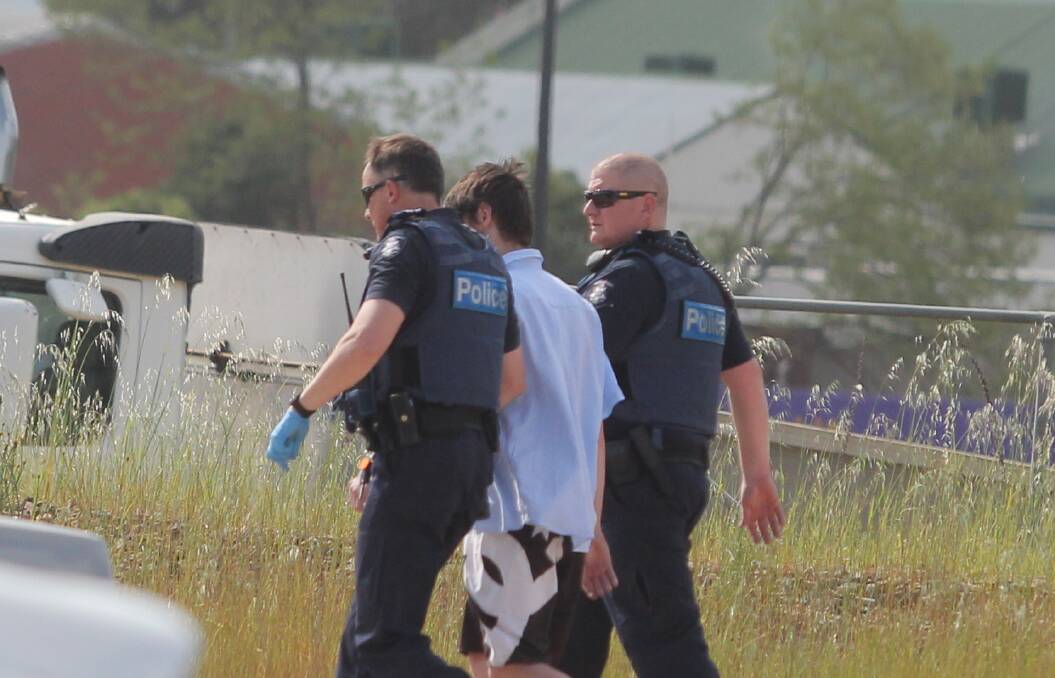 ARREST: The man is taken from the scene by police. Pictures: BLAIR THOMSON