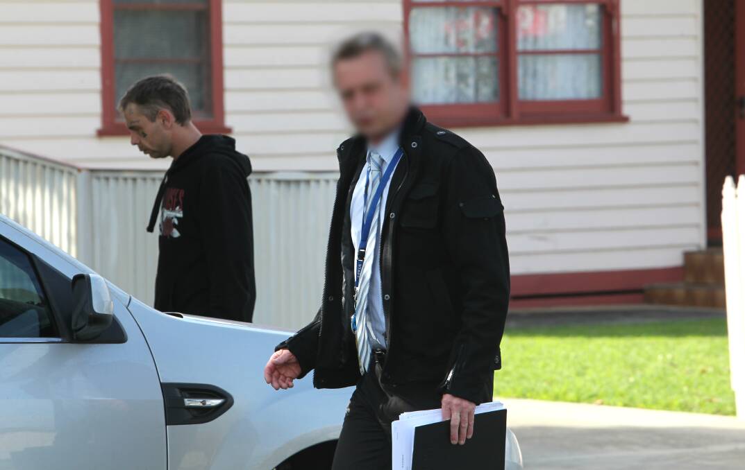 WITNESS: James Ferguson, pictured left with a homicide detective outside the home. He saw the incident unfold and said it was over a misunderstanding, and never should have happened. Picture: BLAIR THOMSON