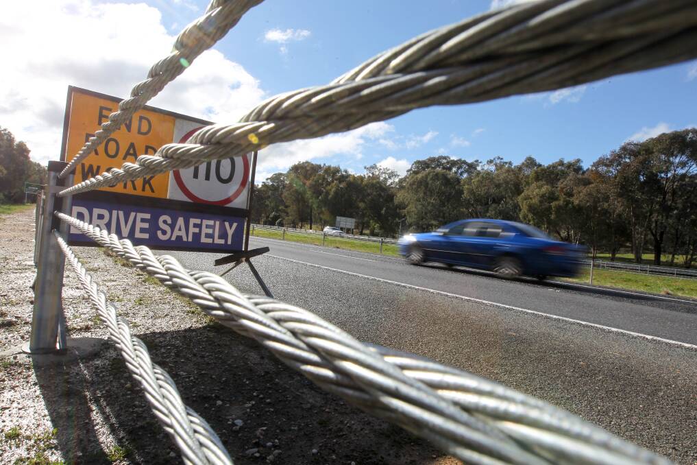 SAFETY: A new section of wire rope barriers on the Hume Highway at Barnawartha. The safety devices are being installed on large sections of the Hume. Picture: BLAIR THOMSON