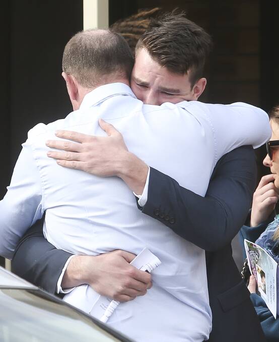 VITAL SUPPORT: Mourners console each other after Jessica McLennan's funeral in Wodonga on Thursday. Picture: ELENOR TEDENBORG