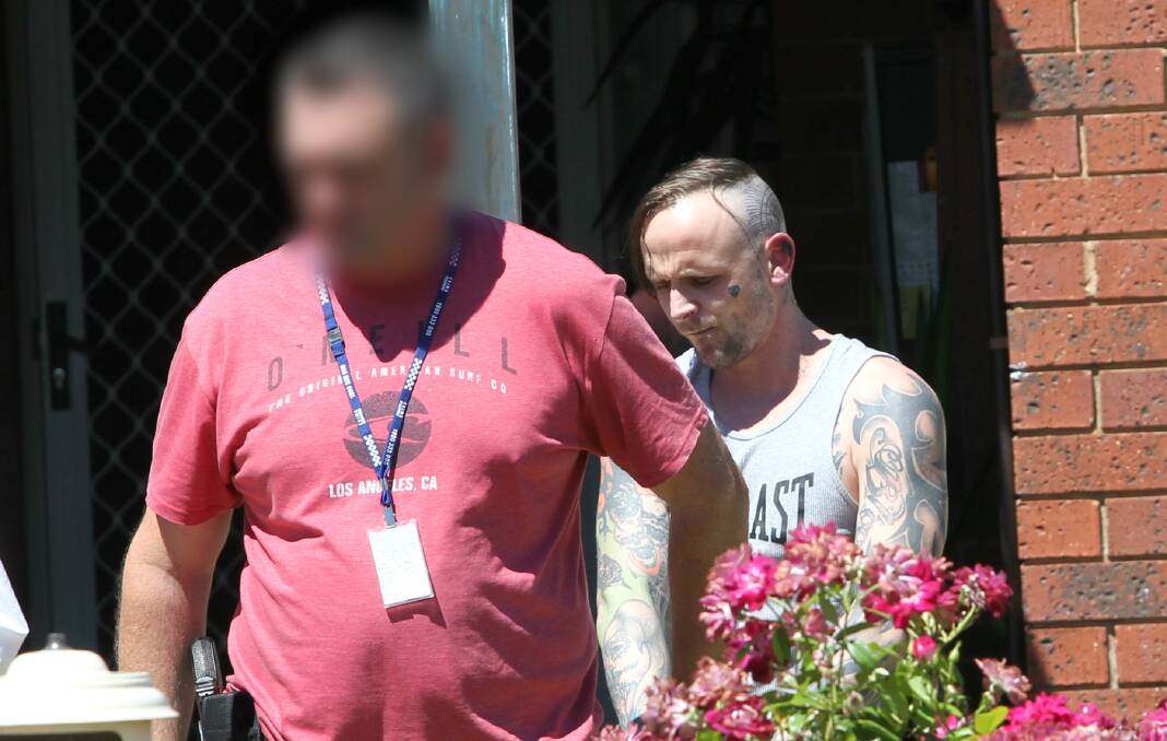 ARRESTED: Police take Ben Heather into custody outside his Lavington home in January. Police removed bags containing ice, and other items including mobile phones and cash during raids targeting methamphetamine supply. 