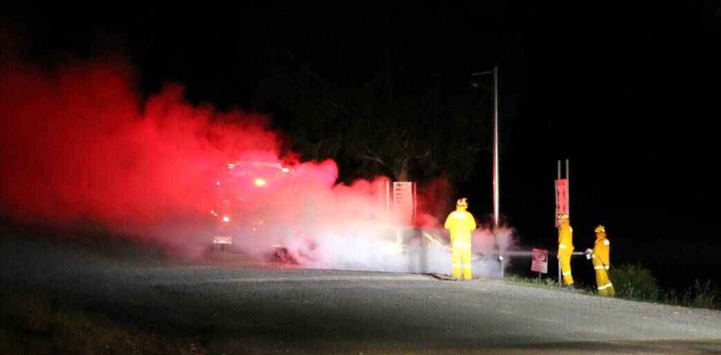 TORCHED: A nearby camper took a photo of a car burning at Kookaburra Point on Thursday morning. Police are investigating possible links between the crimes. 