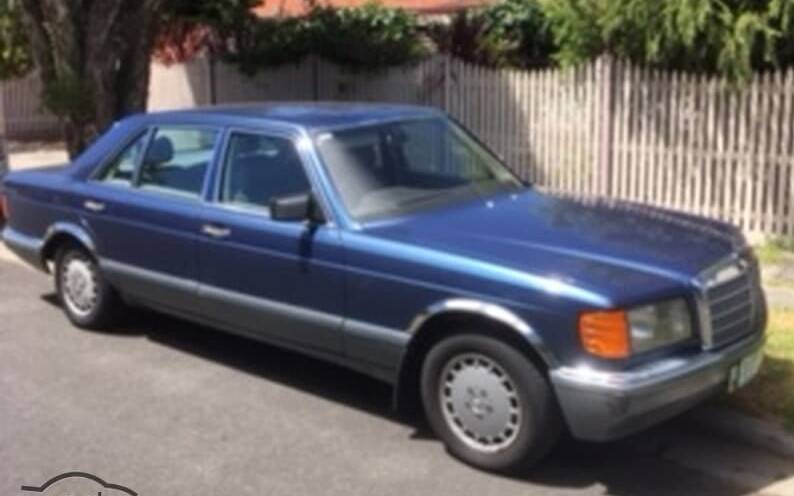 A blue 1988 Mercedes 