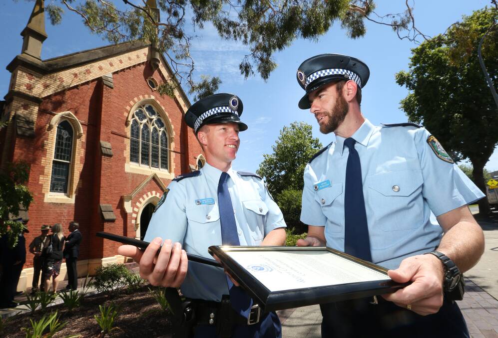 COMMENDATION: Senior Constable Rowan Weekley and Constable Michael McLeish pulled a driver out of his burning car last year and were recognised for their bravery at an awards ceremony on Tuesday. Picture: KYLIE ESLER