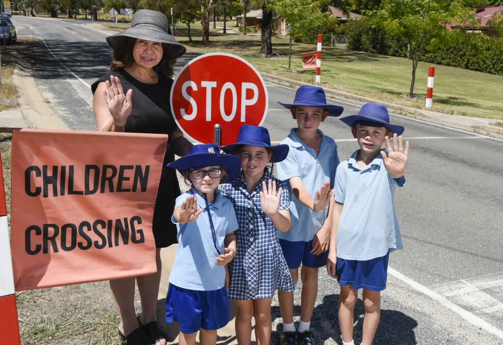 WARNING: Princiapl Deb Bowman with students Lily and Abby Dinneen, and Jackson and Bradley Eberle outside Kiewa Valley Primary School.