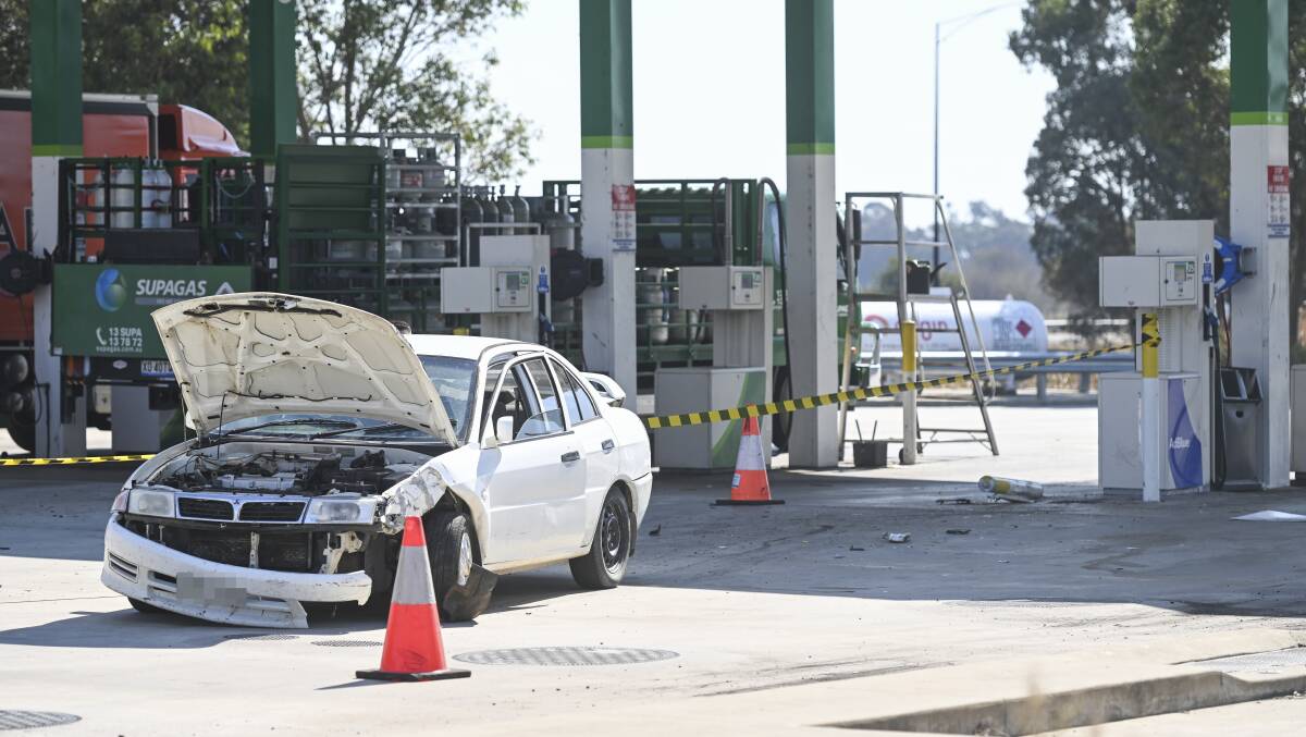 The white Mitsubishi crashed into a bollard at the Barnawartha BP on Tuesday. Picture by Mark Jesser