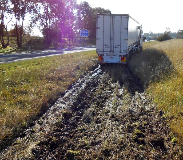 BOGGED:  A truck driver has narrowly avoided vehicles on the wrong side of the Hume Highway before becoming bogged in the centre strip on Tuesday. Police allege the man tested positive to methamphetamine. 