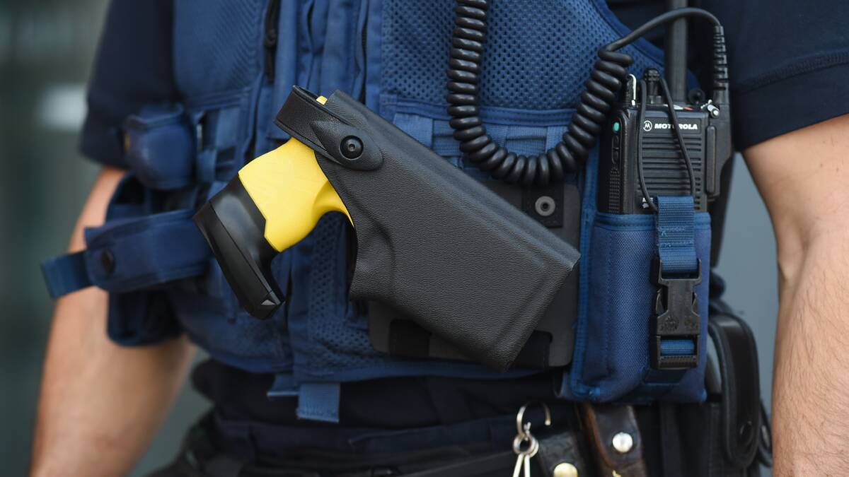 ARMED: A Wangaratta police officer wearing a Taser. 