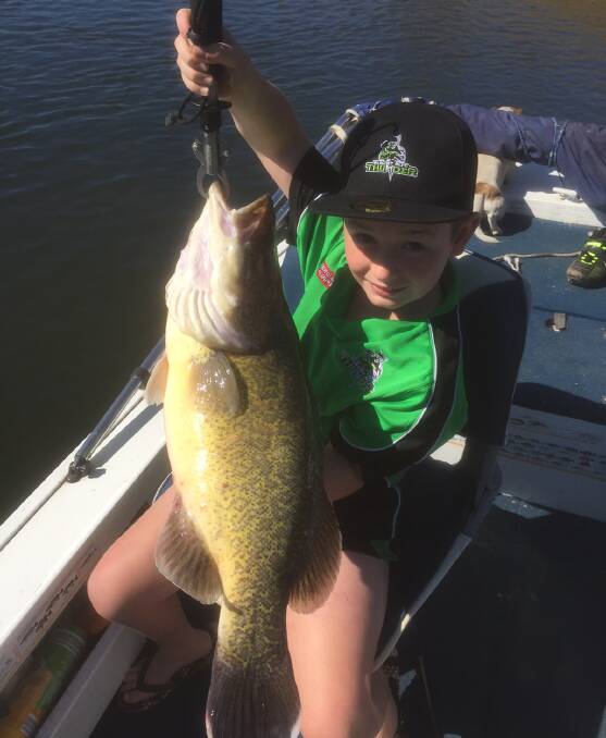 PERSONAL BEST: Clifton Newton, 9, pictured with the 67cm cod he caught in the Murray River recently. The cod was a personal best for Clifton.