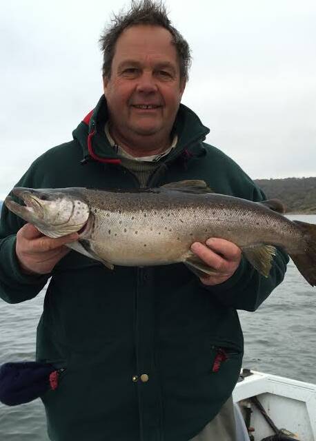 NICE: Peter Mason pictured with the trout he caught at Jindabyne. Compleat Angler's Russell Mason says this is what fishos can expect to catch in the Jindabyne area at the moment.
