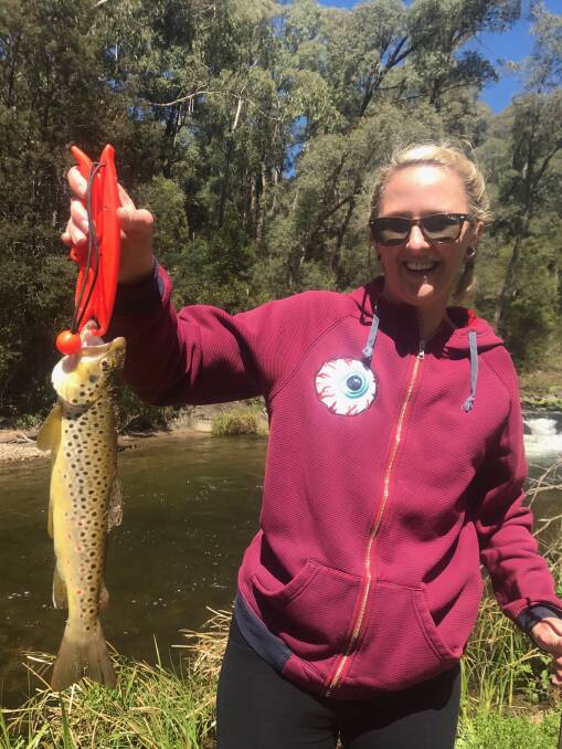 NICE CATCH: Ruth Pennybridge pictured at Snowy Creek with her first trout caught on her new rod.