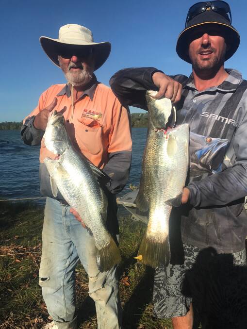 BEAUTIES: Rod Gogoll and son Joel pictured with some nice barramundi they caught in the Northern Territory.