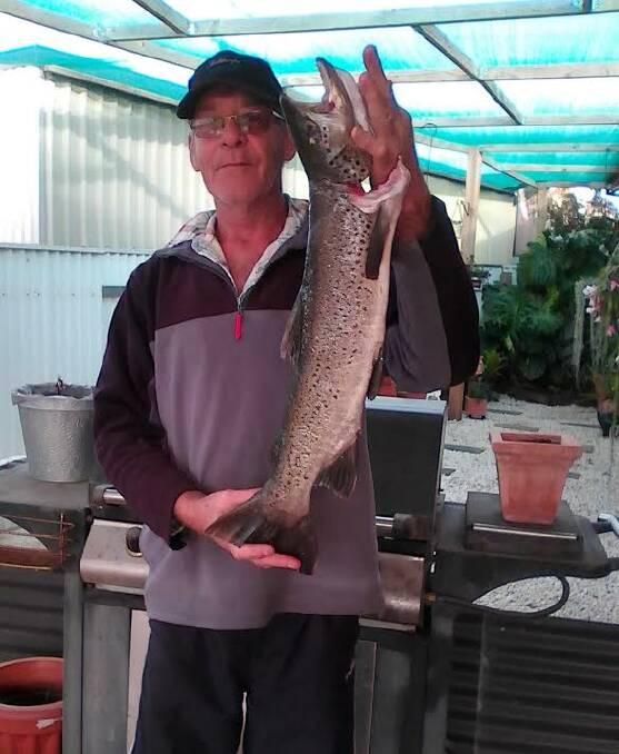 NICE: Bill Dittko with the 65cm trout he caught while trolling between the Hume Resort and the weir wall. Bill was very happy with his catch.