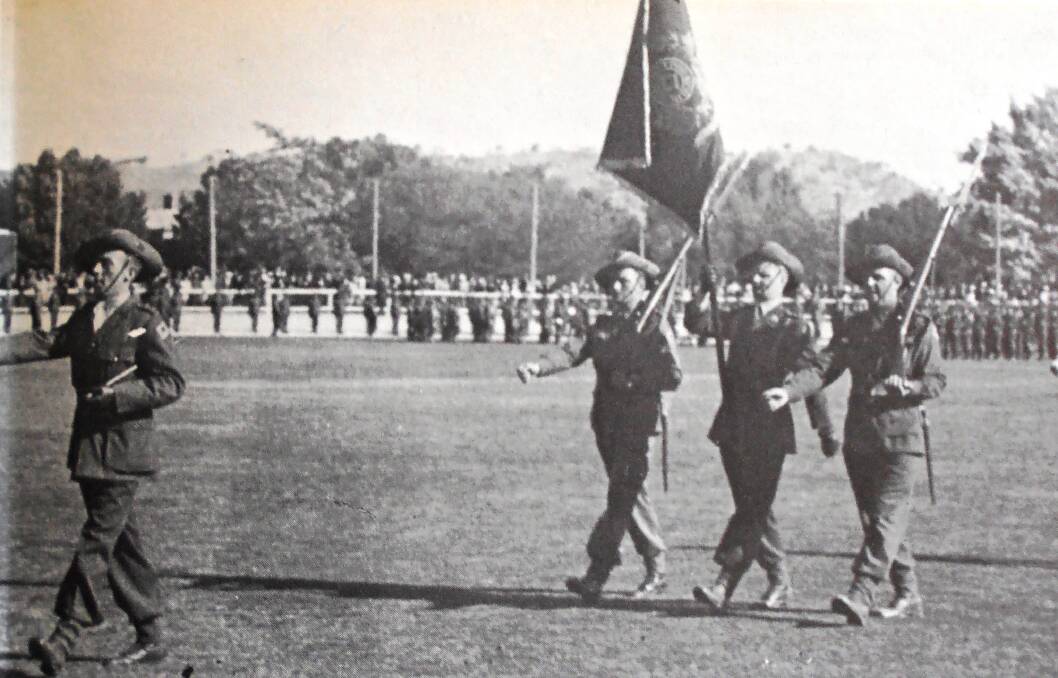 GREAT PRIDE: The 2/23rd Battalion (Albury’s Own) Colour party pictured marching at Albury Sportsground, November 3, 1940.