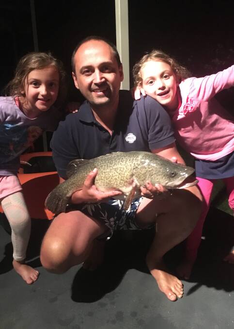 CATCH: Staying up late paid off for twins Amelia and Isabella. The sisters went fishing with dad, Daniel Loukidis, and managed to land this Murray cod. The cod was caught in Bundalong.