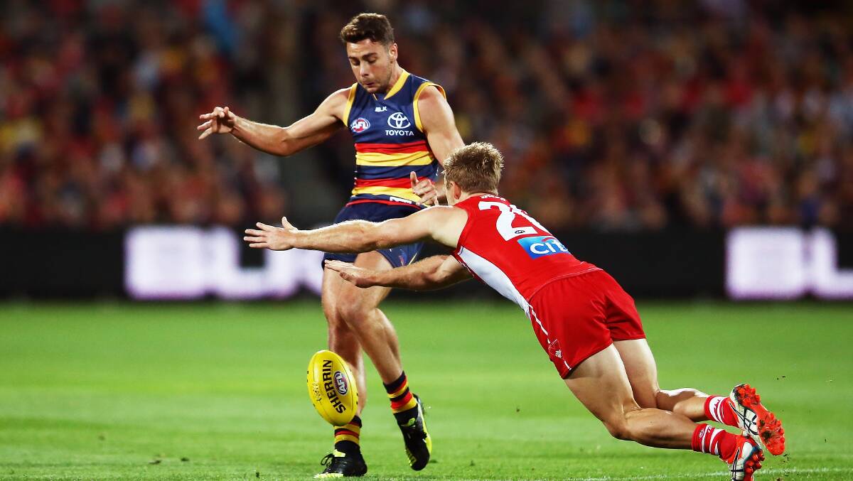 ADELAIDE, AUSTRALIA - APRIL 16: Rory Atkins of the Crows kicks the ball during the round four AFL match between the Adelaide Crows and the Sydney Swans at Adelaide Oval on April 16, 2016 in Adelaide, Australia. (Photo by Morne de Klerk/Getty Images)