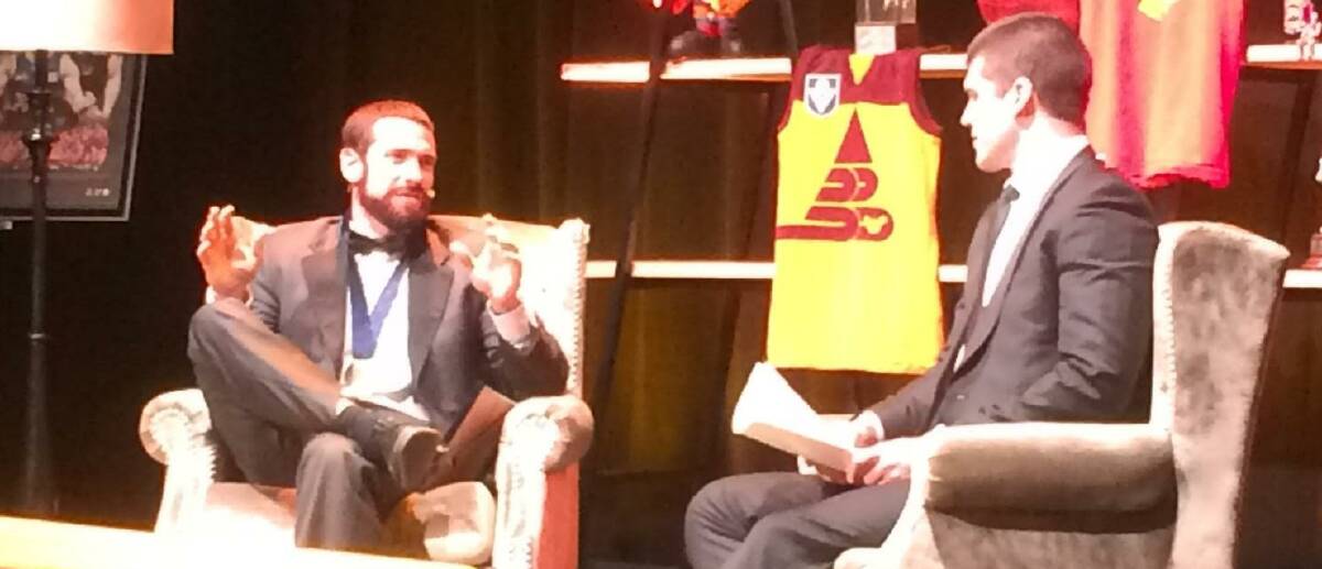 ON THE COUCH: Jason Akermanis has a chat with former teammate Jonathon Brown at the Brisbane Lions' Hall of Fame dinner at Melbourne’s Grand Hyatt ballroom.