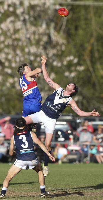 HIGH WAY: Thurgoona ruckman Adam Way flies high against Mitta United's Jeff Cox in the centre square at Sandy Creek on Saturday. Pictures: ELENOR TEDENBORG