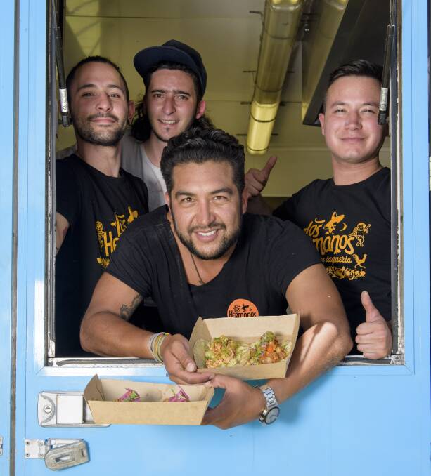 TACO TRUCK: Los Hermanos Mexican Taqueria operators Bruno Carreto (front), Felipe Arias, Andres Lopez and Juan Duran at the Yarrawonga carnival in January this year. Picture: SIMON BAYLISS