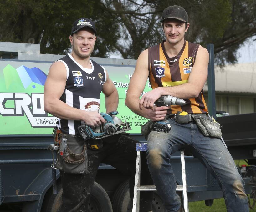 LONG AND THE SHORT OF IT: Magpie Matt Kelly and Rover Shane Gaston take time out from their carpentry and construction business ahead of Sunday's Wangaratta derby at Norm Minns Oval. Picture: ELENOR TEDENBORG