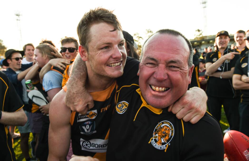 MILESTONE MAN: Albury co-captain Luke Daly, pictured with club stalwart Ross Ried after the 2015 grand final, will play his 150th senior match for the Tigers on Saturday.
