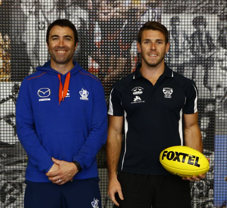 ROO BEAUTY: North Melbourne coach Brad Scott with Rutherglen footballer Jak Hancock during the Cats player's tour of Arden St recently.