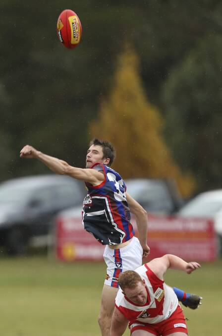 SPOILER ALERT: Beechworth's Gareth Pritchard flies over the top to spoil in the Bushrangers' 18-point win over Chiltern on Saturday. Pictures: ELENOR TEDENBORG