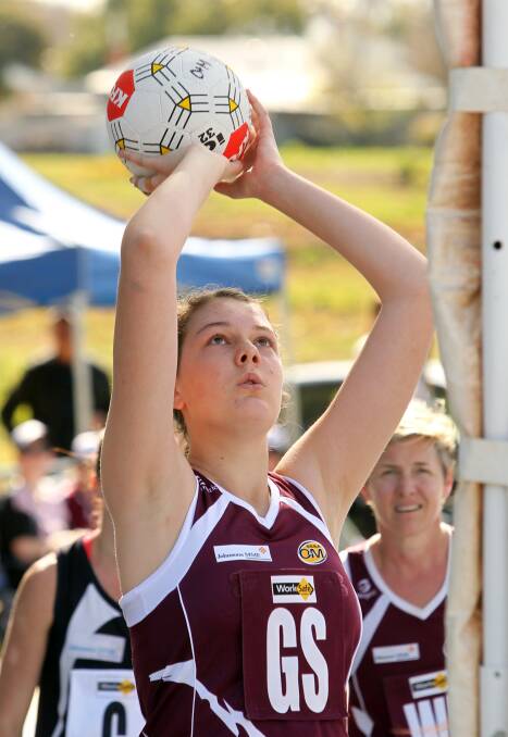 SHOOTING STAR: Jane Cook takes aim for the Wodonga Bulldogs in the O and M.