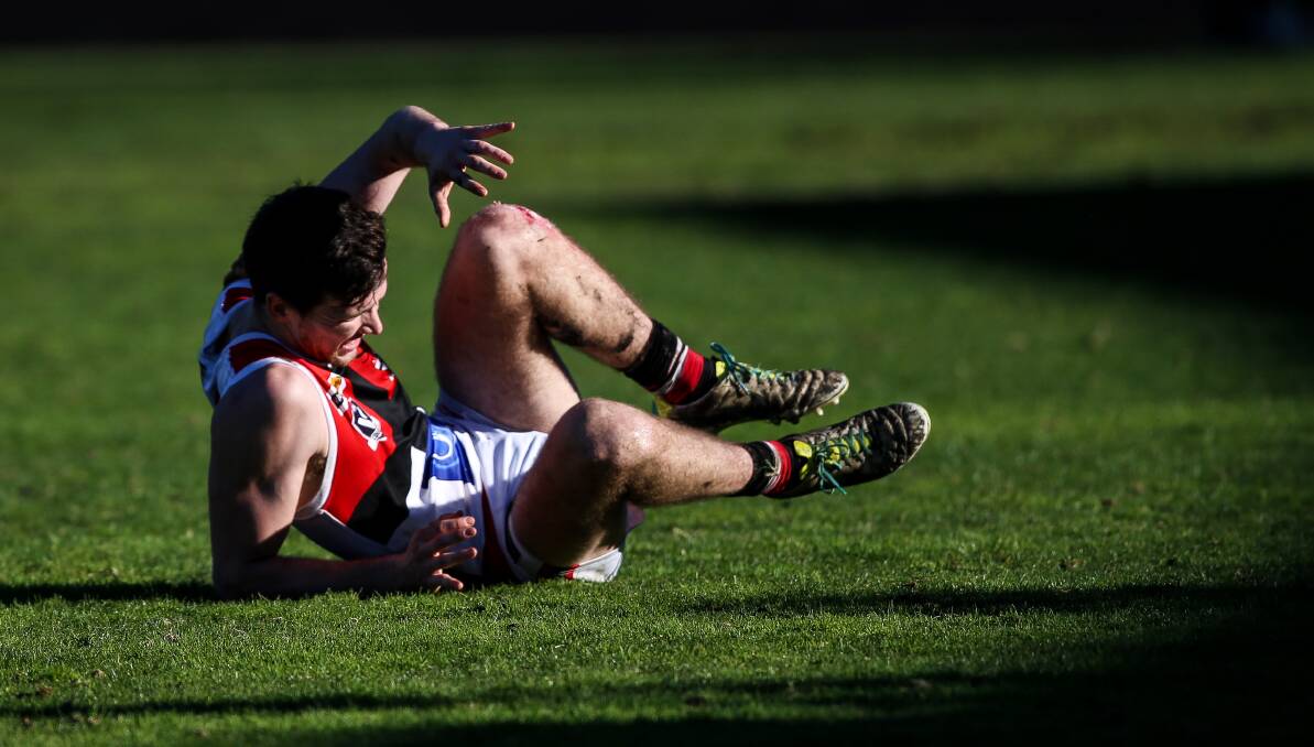 OUCH: Frazer Dale was one of Myrtleford's best players in the first half before injuring his ankle late in the second term. Picture: JAMES WILTSHIRE
