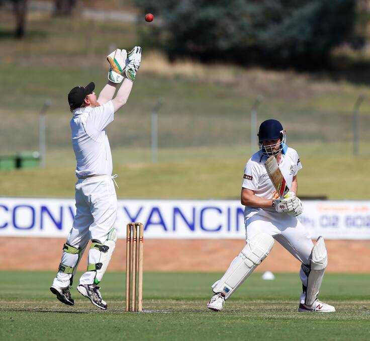 GOT HIM: Lavington wicketkeeper Jarryd Weeding tosses the ball into the air after dismissing Albury batsman Brad Smith for five off the bowling of Will Herriot. Pictures: MARK JESSER