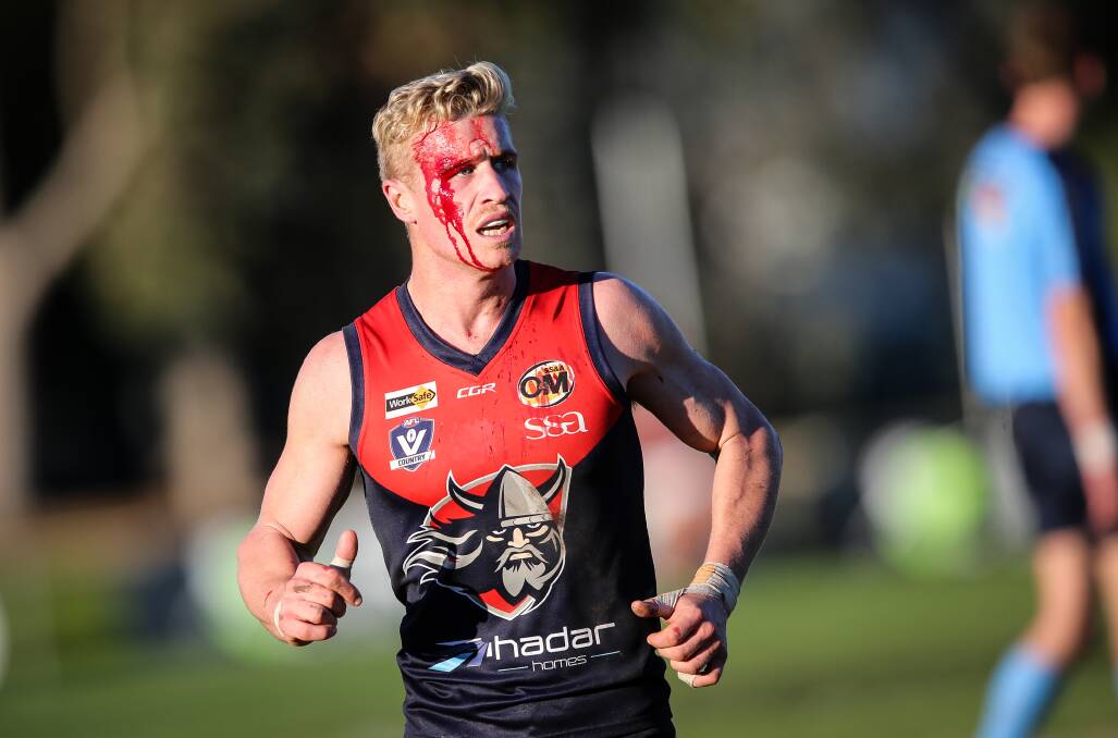 BLOOD BOILING: Wodonga Raiders star Steve Jolliffe leaves Birallee Park after copping a hit from Bulldog Dylan Beattie in the last quarter of Saturday's match. Picture: JAMES WILTSHIRE