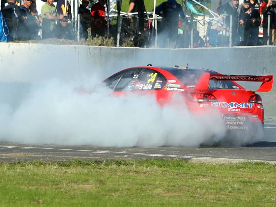 EAT MY DUST: Tim Slade gives his tyres a workout to celebrate a stunning weekend at Winton.