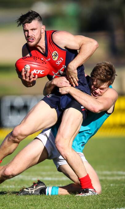 PAIR OF JACKS: Wodonga Raiders captain Jack Di Mizio is tackled by Lavington's Jack Nunn during Saturday's clash at Birallee Park. Picture: JAMES WILTSHIRE