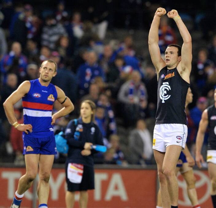 FRAZER THE AMAZER: Frazer Dale celebrates a goal after the siren in his debut for Carlton to defeat the Western Bulldogs in 2012. Daniel Cross, who is now at Albury, looks on in disappointment. Picture: FAIRFAX IMAGES