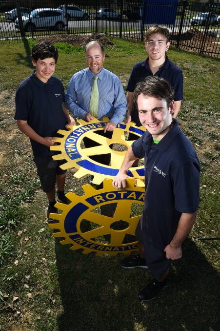 BIG IDEA: Belvoir Special School's Jimmy Rebuffo, 16, Principal Jamie Gay, Brandyn Larkins, 18, and Liam Knight, 17, where a skills building will go up. Picture: MARK JESSER