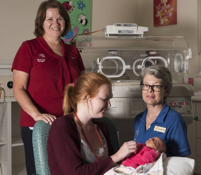 TOP CARE: A thrilled nurse unit manager Kathy O'Brien with Shirley Ralston and her 16-day-old daughter Elizabeth, and special care nurse Raylene Hare after the Wodonga nursery's win in an online poll. Picture: SIMON BAYLISS