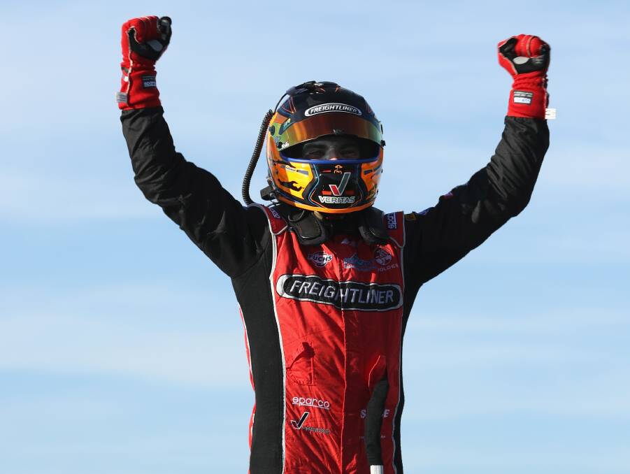 YOU LITTLE BEAUTY: Tim Slade raises his arms in triumph after winning back-to-back races.