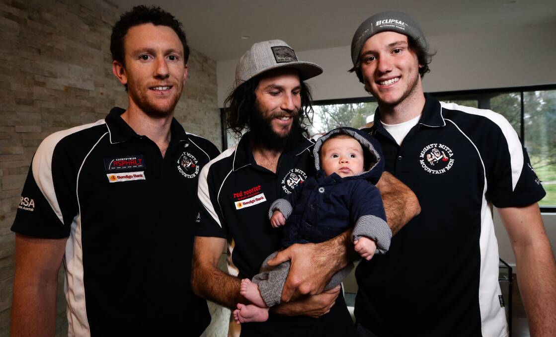 GROUP PIC: Jarrod, Tyson, Hugh, two months, and Sam Gorupic are hoping for a Mitta United grand final victory. Picture: JAMES WILTSHIRE