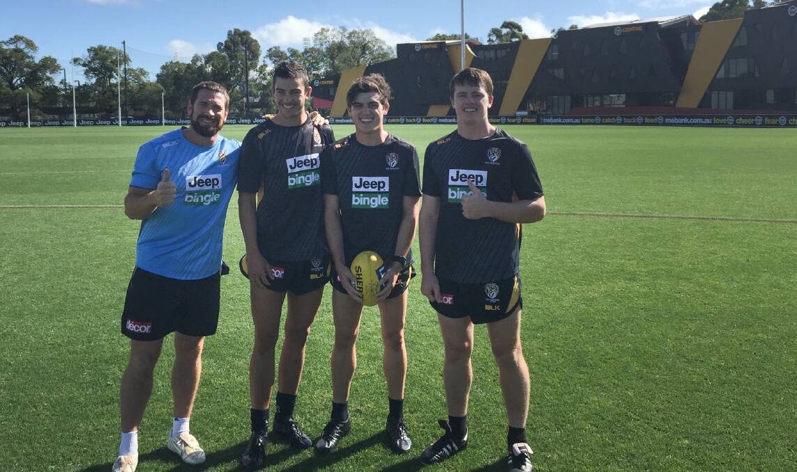 Dom Brew, right, with former North Albury coach Jason Akermanis and teammates Lachie Taylor-Nugent and Shaun Mannagh training at Richmond in 2016. File picture