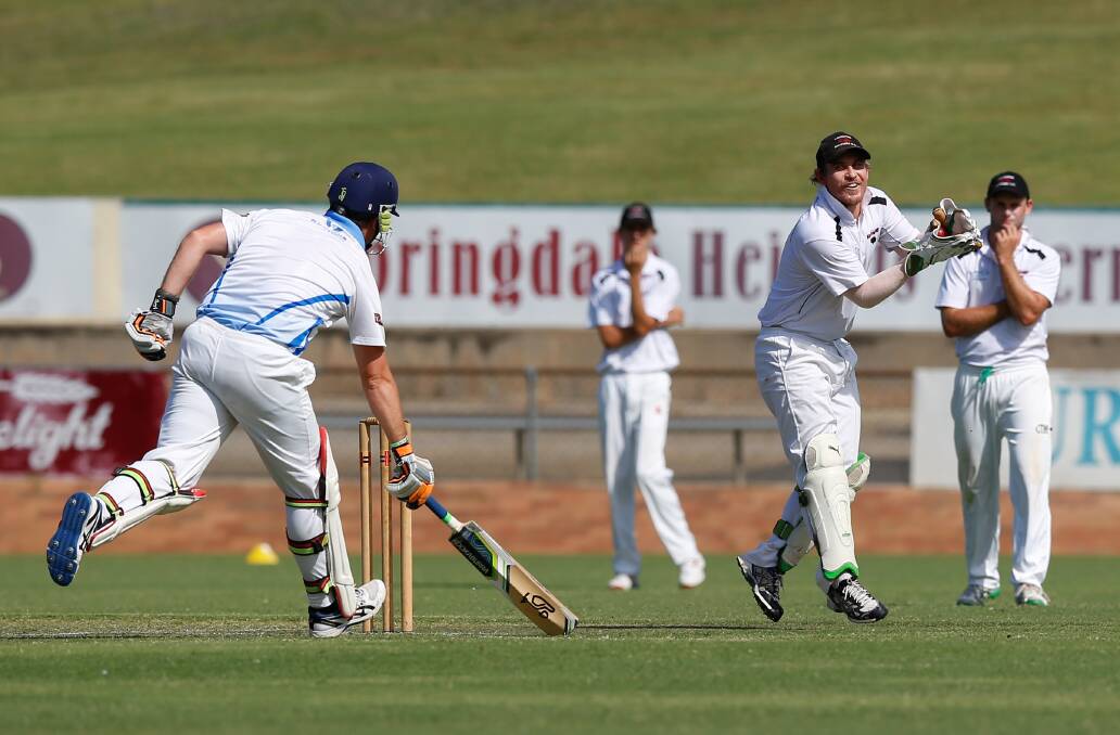 KEEPER'S END: Lavington wicketkeeper Jarryd Weeding takes the ball as Jerim Hayes makes his ground.