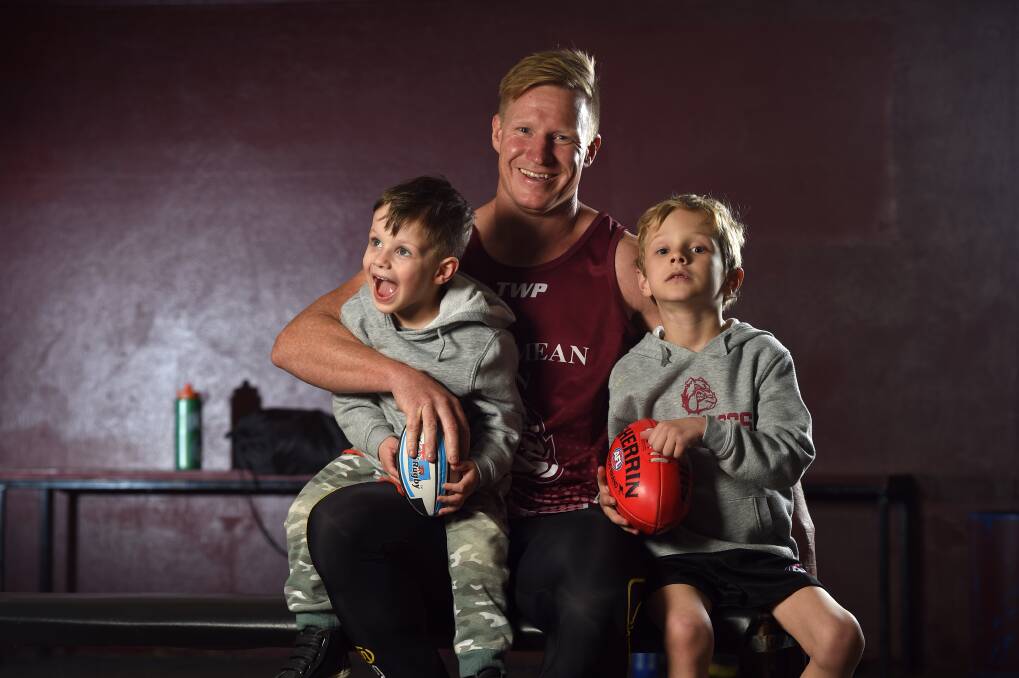 GOOD ON YOU, DAD: Jarrod Twitt prepares for his farewell match with the Bulldogs with sons Jordy, 3, and Hardy, 6, at training on Thursday night. Picture: MARK JESSER