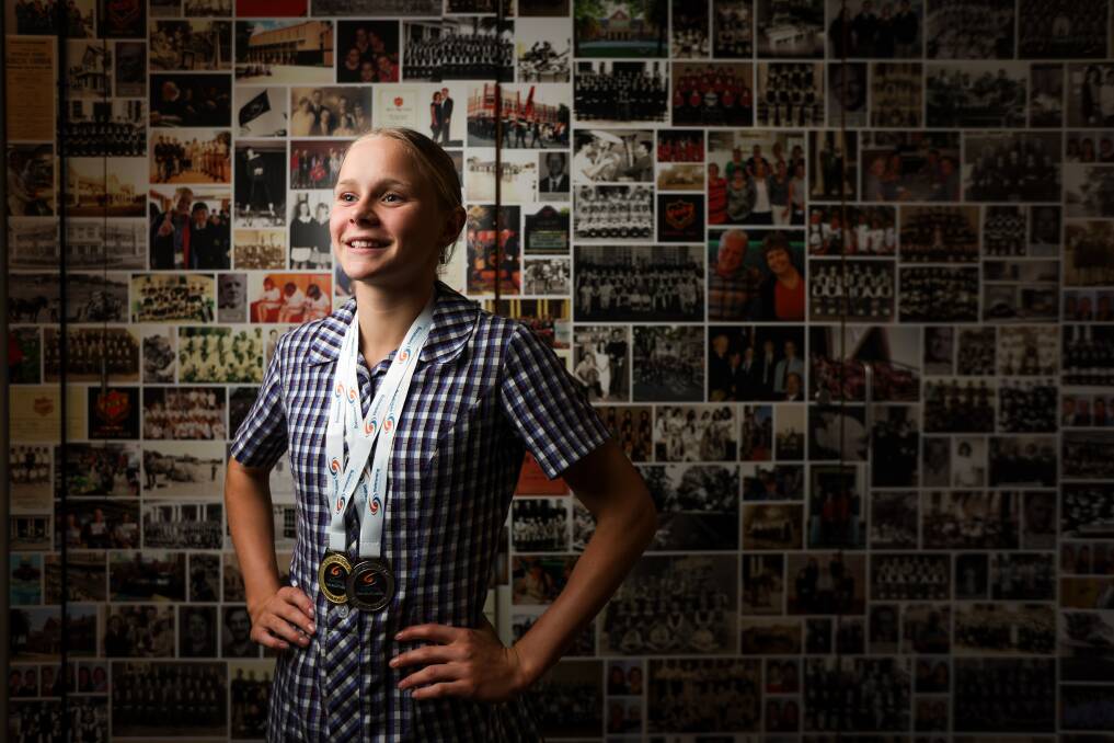 Albury High School student Sienna Toohey with her medals from the NSW Open Swimming Championships. Picture by James Wiltshire