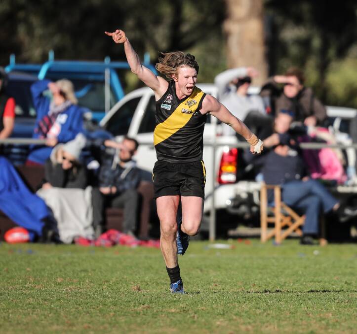 HURT: George Alexander celebrates a goal in Osborne's Hume league grand final win over Jindera at Walbundrie in September, just hours before he was hurt in an accident.