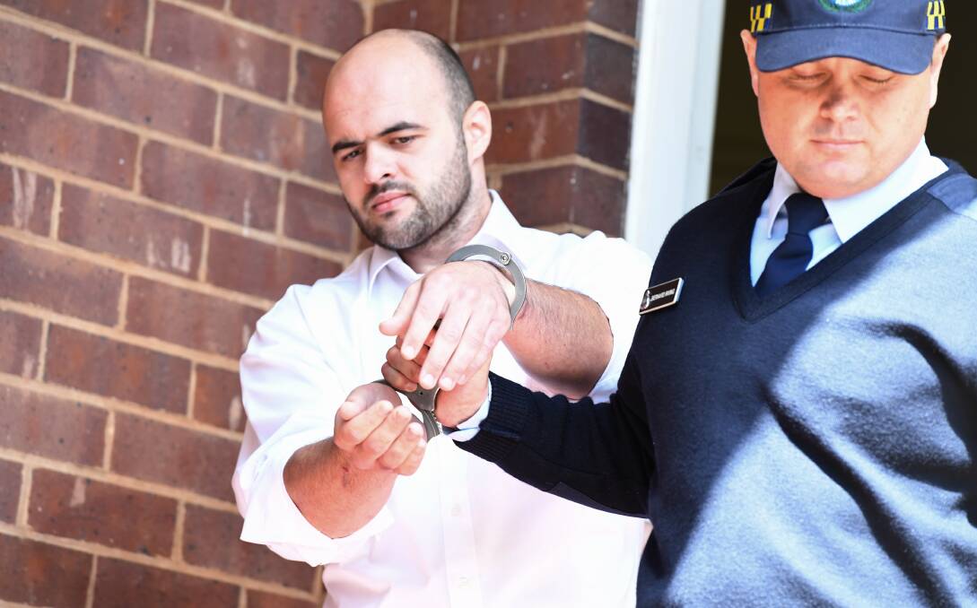 WILL DIE IN JAIL: Vincent Stanford is led out of the Griffith courthouse to be taken to prison where he will spend the rest of his life: Picture: Peter Rea