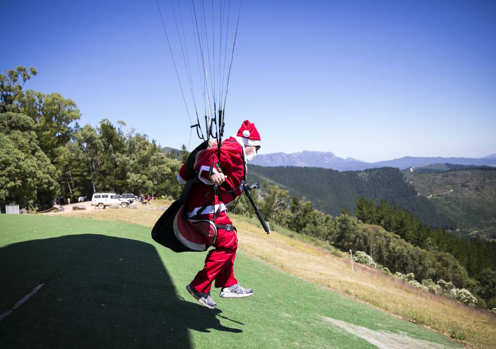 TAKE-OFF: After one false start, Santa was off into the breeze with cheers and jeers from the spectators. 