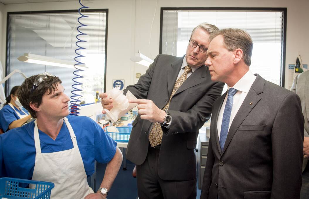 Lightbulb moments: Greg Hunt, Minister Industry, Innovation and Science is given a tour of 3D printing company Anatomics by the company's founder Paul D'Urso. Picture: JESSE MARLOW
